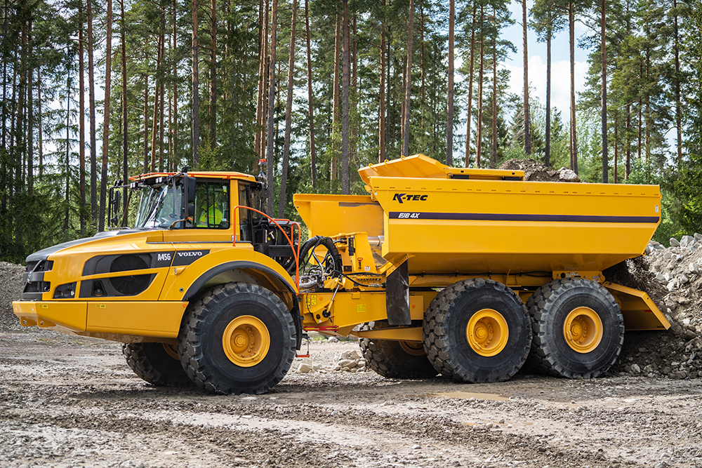 EJB4X Ejector Body on the back of a Volvo A45G articulated hauler allows safe ejection material in areas where overhead clearance is low