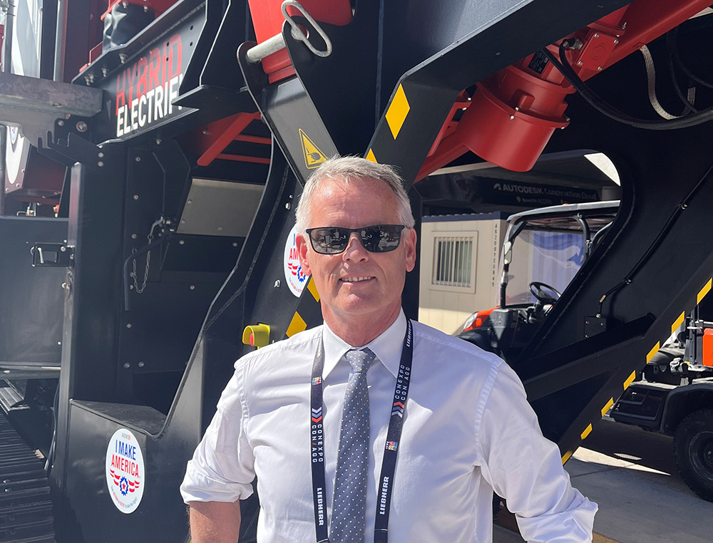 Erwin Schneller, SBM Mineral Processing managing director, in front of the JAWMAX 400 jaw crusher