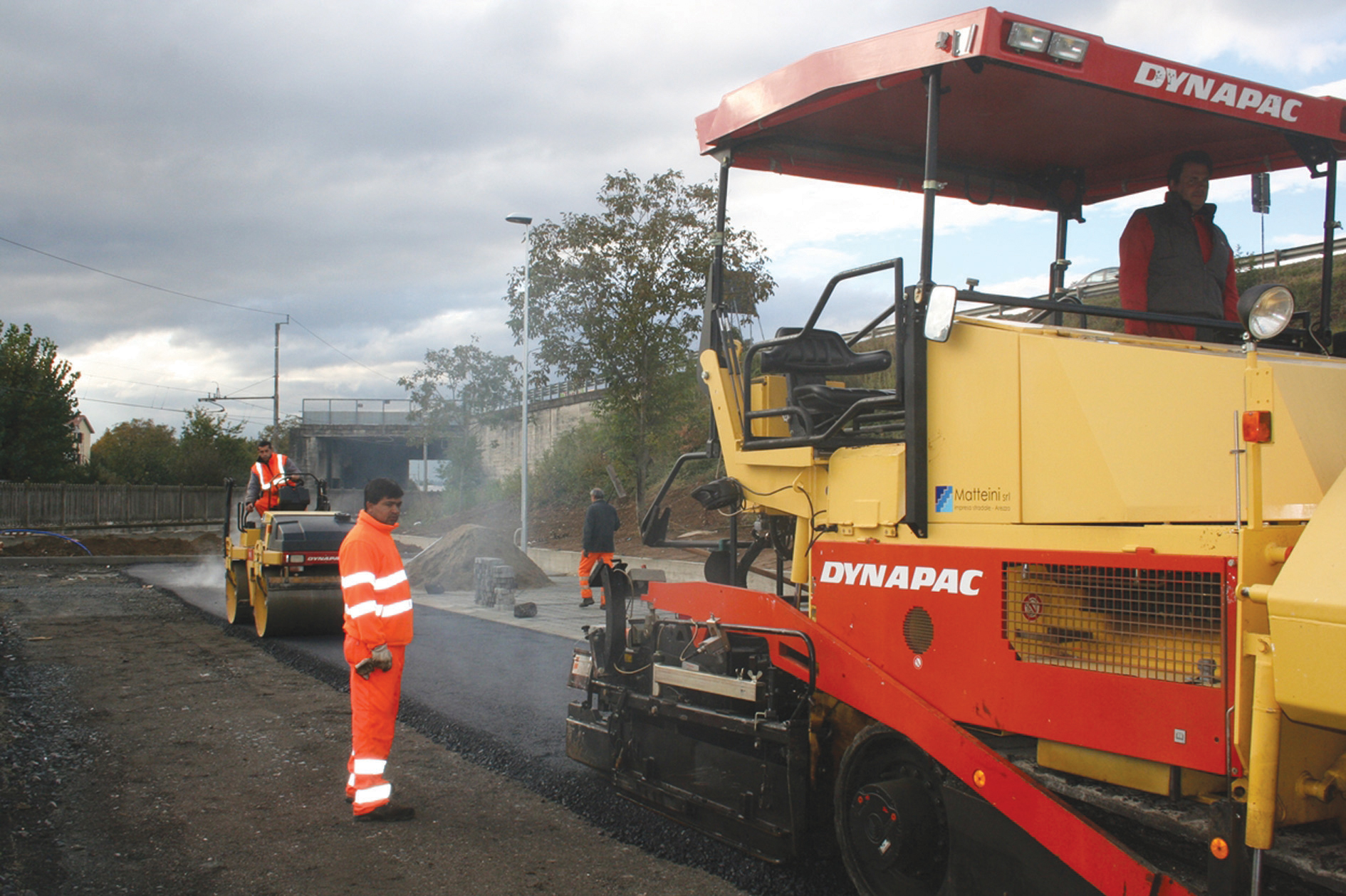 Paver working on road