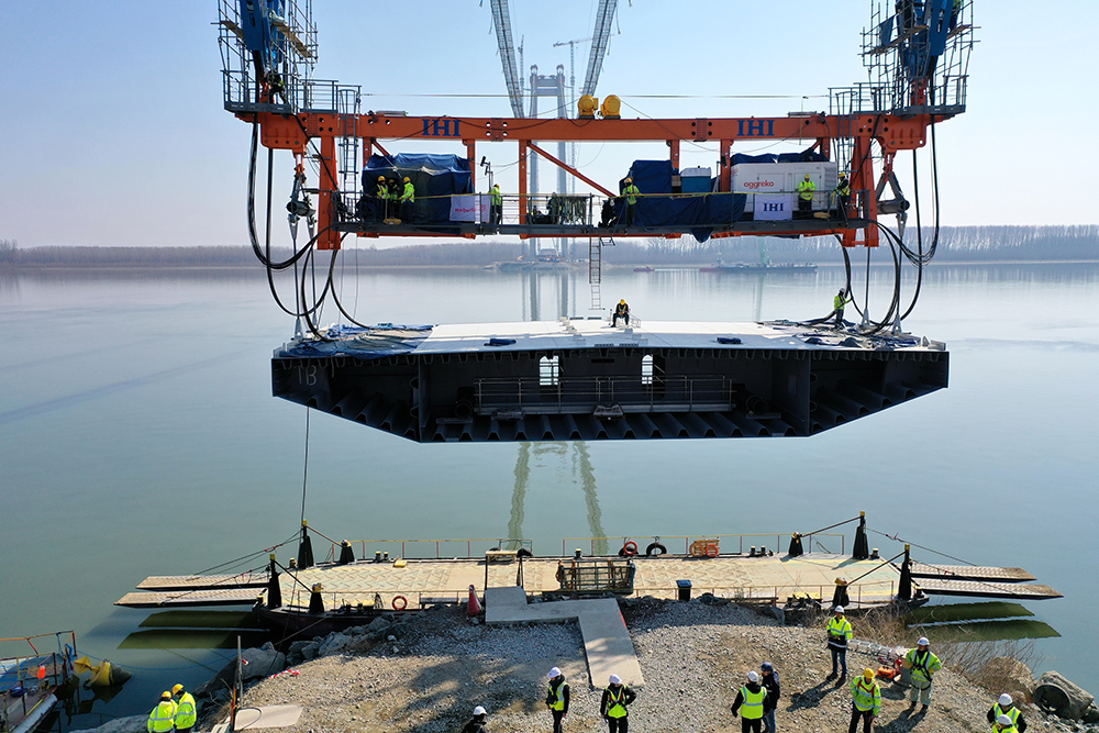 Raising the deck segments into place has required careful precision working