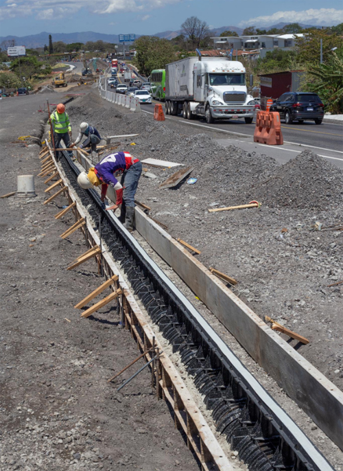 The sections are placed in excavations, with concrete then being poured around