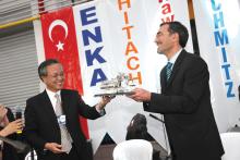 Mr Hironori Okajima presented ENKA Pazarlama's Ali Kara with a model of a large Hitachi excavator