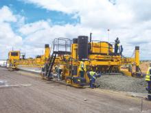 Concrete paving activity with a GOMACO machine has to fit in with climactic conditions at a job to refurbish Botswana's main airport.