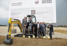 A silver spade ceremony marks the start of construction at the new Wacker Neuson plant