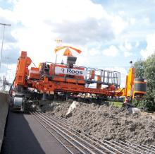 Crawler excavator behind the concrete