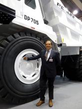 Dr Maurizio Perlini next to Perlini DP 705 WD dump truck 