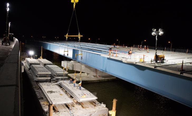 Concrete sections being placed on approach road girders