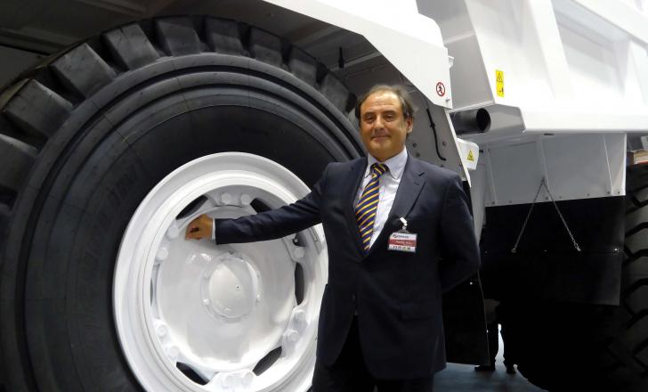 Dr Maurizio Perlini next to Perlini DP 705 WD dump truck 