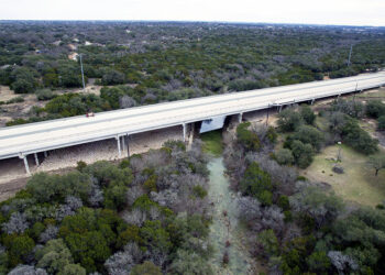 A new bridge carries the route over Bear Creek
