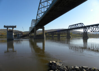 From the eastern bank of the Peace River, the new piers await arrival of the deck
