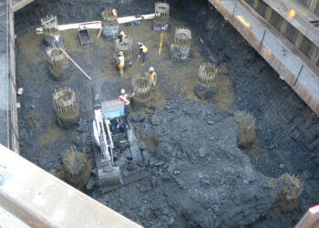 Pile work inside a coffer dam for pier construction: removal of walers would later prove challenging