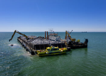 Work continues in June on a breakwater for the harbour in Rødbyhavn where sections of the tunnel will be constructed and floated out for placement (photo copyright Femern/Nils Lund Pedersen)
