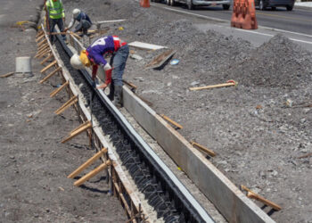 The sections are placed in excavations, with concrete then being poured around