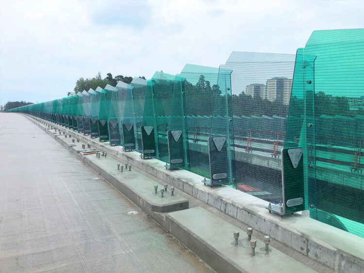 The PostFree system is held by a steel plate, or a steel “foot”, that is embedded into or bolted onto the cement curb or a bridge’s superstructure