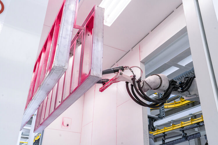 Automatic, digital and flexible: Doka’s new powder-coating plant selects the right powder application method, such as the robot hand, to suit a client’s needs (image courtesy Doka)