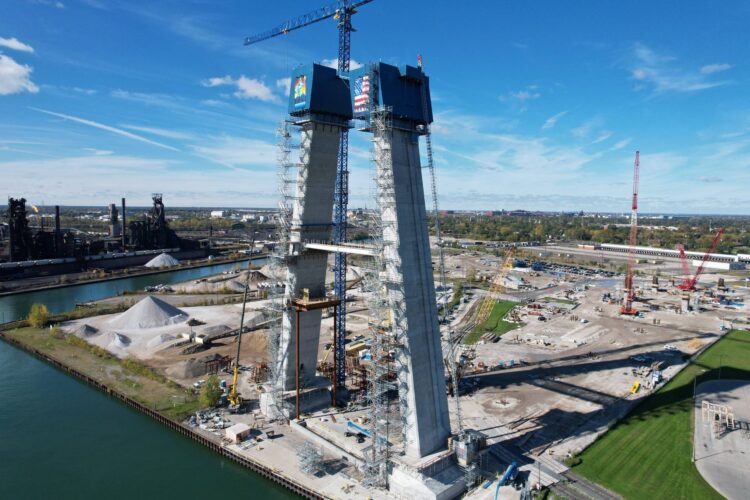 Temporary struts are connecting and supporting both pairs of towers as they continue to climb on opposite banks of the Detroit River, which is the border between Detroit in the US and the Canadian city of Windsor (image courtesy Windsor-Detroit Bridge Authority)