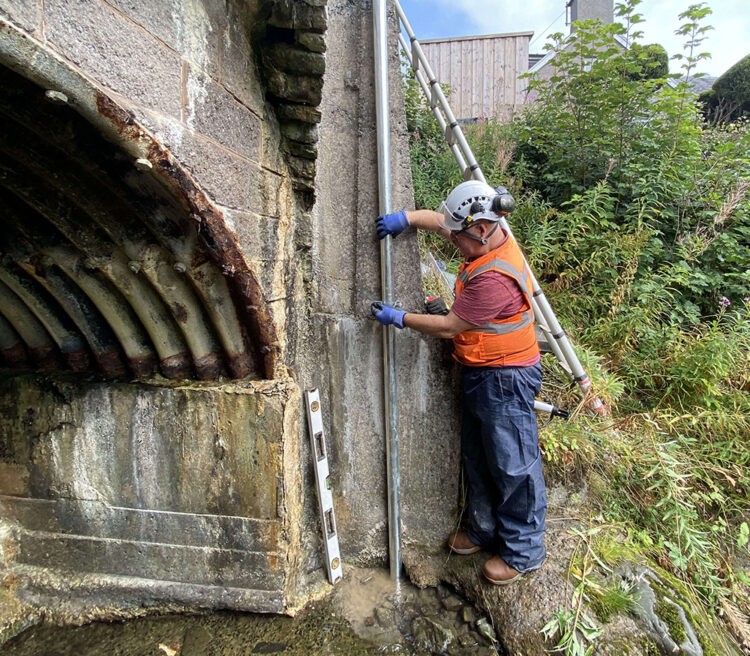 Installation of an OTT ecoLog 1000 water level logger in a stilling well with cellular data connection to Hydromet Cloud for the Vales Burn bridge trial in Scotland (image courtesy OTT HydroMet/Transport Scotland)