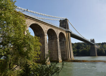 The Grade I listed structure crosses the Menai Strait between the Welsh island of Anglesey and mainland north Wales (image © Peewam/Dreamstime)