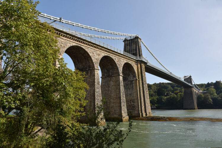 The Grade I listed structure crosses the Menai Strait between the Welsh island of Anglesey and mainland north Wales (image © Peewam/Dreamstime)