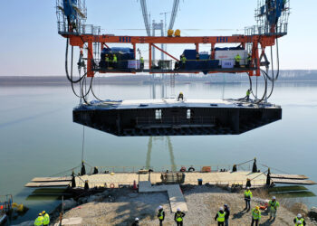 Raising the deck segments into place has required careful precision working