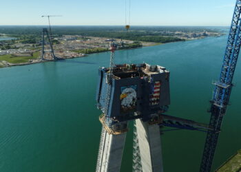 Tower on the US side of the Detroit River, looking over the Canadian tower in Windsor, Ontario – July 2022 (image courtesy Windsor-Detroit Bridge Authority)