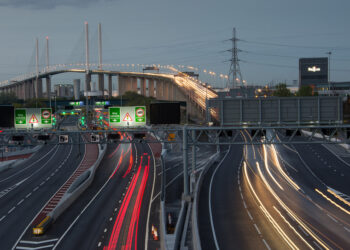 Part of England’s Strategic Road Network is the Dartford River Crossing near London that includes the Queen Elizabeth Bridge over the Thames River as well as a parallel tunnel under the water (image © Chris Moncrieff/Dreamstime)
