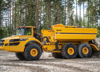 EJB4X Ejector Body on the back of a Volvo A45G articulated hauler allows safe ejection material in areas where overhead clearance is low