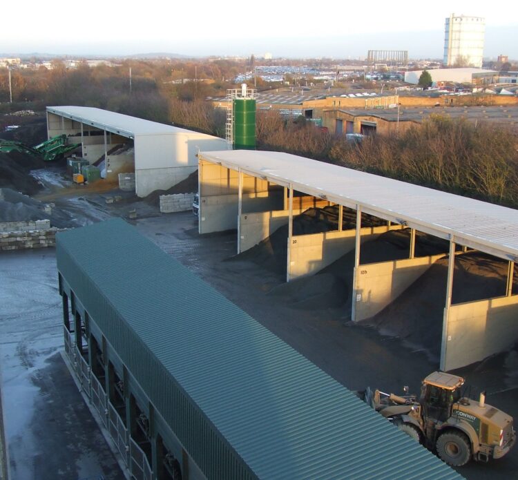 Recycling materials such as reclaimed asphalt into new mixes and employing electric machines can help achieve sustainability targets in road construction - image © courtesy of Mike Woof