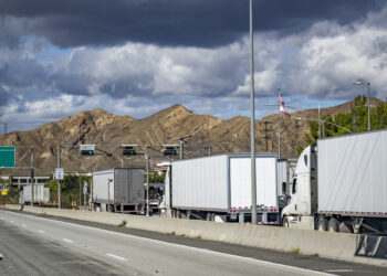 Traditionally, law enforcement agencies have used permanent, sometimes called fixed, roadside stations to weigh and inspect trucks and there can be lineups (image © Vitpho/Dreamstime)
