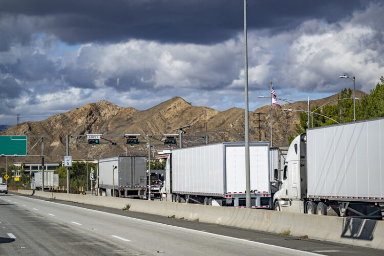 Traditionally, law enforcement agencies have used permanent, sometimes called fixed, roadside stations to weigh and inspect trucks and there can be lineups (image © Vitpho/Dreamstime)