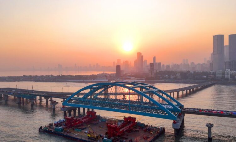 The new steel girder arch bridges - one for southbound traffic and one for northbound - were built at the nearby Mazagon Dock's Nhava unit (image courtesy X/BMC)
