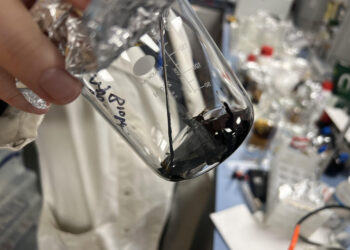 A beaker full of algae biomass