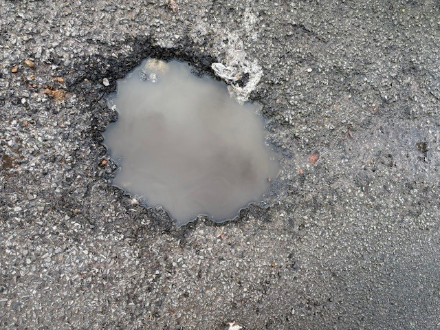 A new technology will help reduce the risk of potholes, by allowing road surfaces to repair themselves in-situ – image courtesy of Mike Woof