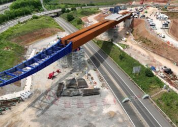 A new bridge spanning the UK’s busy M6 motorway will carry the HS2 high speed rail link