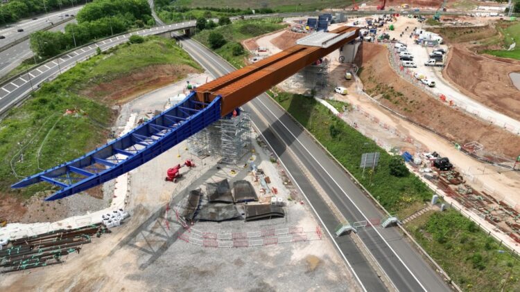 A new bridge spanning the UK’s busy M6 motorway will carry the HS2 high speed rail link