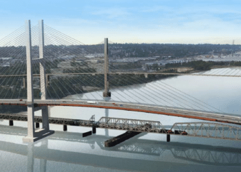 Crews are working on bridge finishes, including fencing, utilities, barriers and expansion joint installation, which will be followed by asphalt paving later this summer (image courtesy Transportation Investment Corporation/Partnerships British Columbia)