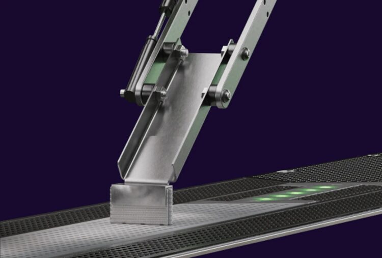 A vehicle is charged automatically via a pick-up that folds down under the vehicle to a rail on the ground (image courtesy Elonroad)
