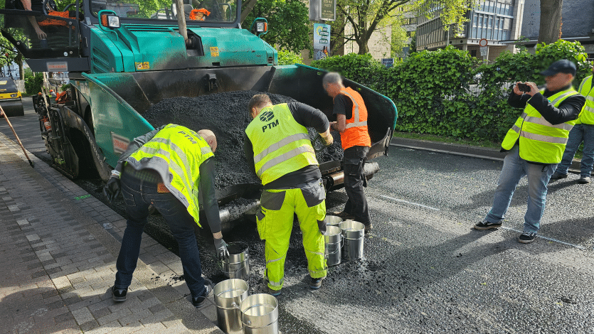 Photo 3: Sampling of asphalt mix for control tests and performance investigations by PTM