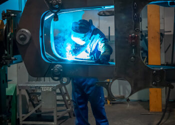 Manufacturing is from the bottom up, from laser-cutting of steel plate to the welding of chassis, from engine and cab installation to final painting and livery applications