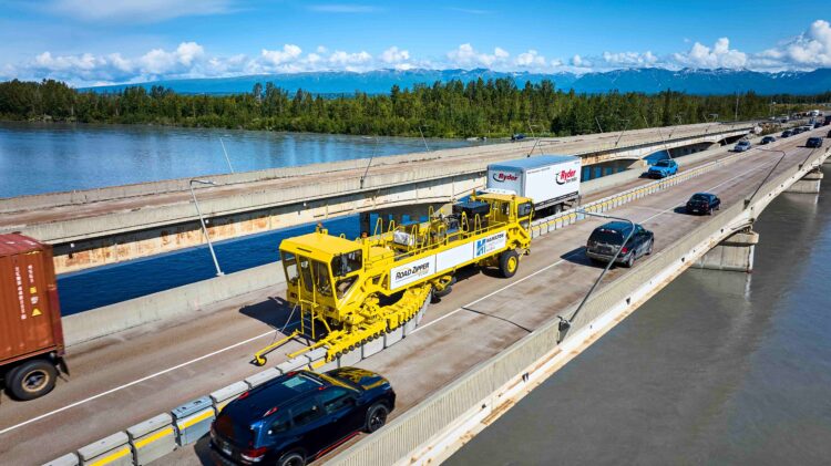 Barrier Transfer Machine reconfiguring travel lanes under traffic minimizing disruption to traffic flow during transfer operation (image courtesy Lindsay)