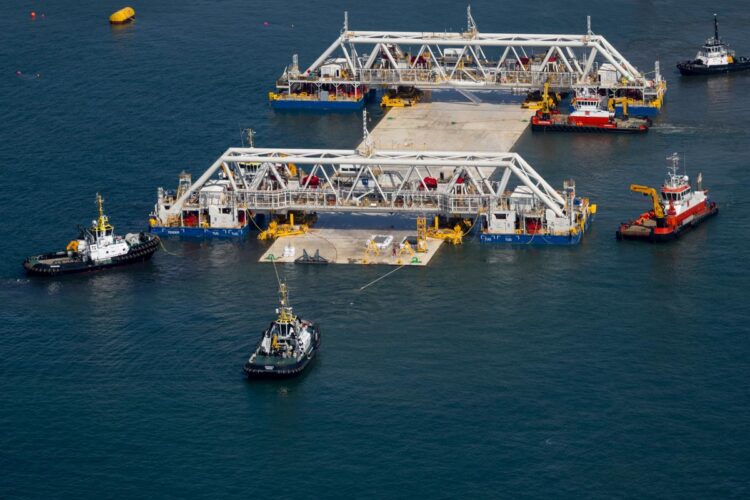 The first section of the submerged part of the Fehmarnbelt Tunnel between Denmark and Germany was towed into position in the Baltic Sea and lowered into the trench on the seabed (image courtesy Sund & Bælt)