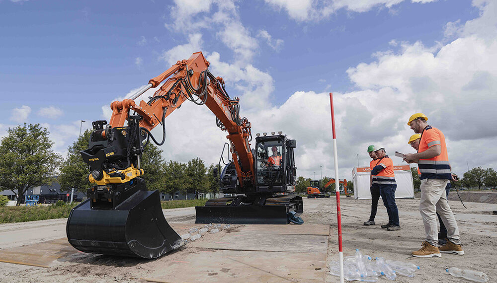 One of the tasks involved flipping bottles up from the ground (Image: Hitachi Construction Machinery Europe/HCME)