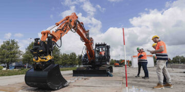 One of the tasks involved flipping bottles up from the ground (Image: Hitachi Construction Machinery Europe/HCME)