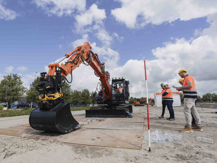 One of the tasks involved flipping bottles up from the ground (Image: Hitachi Construction Machinery Europe/HCME)