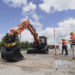 One of the tasks involved flipping bottles up from the ground (Image: Hitachi Construction Machinery Europe/HCME)